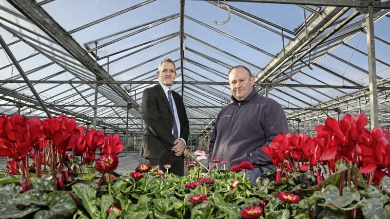 Wilderness Flower &amp; Garden Centre owner Kyle Archer (right) with Ulster Bank business development manager Paul Reid 