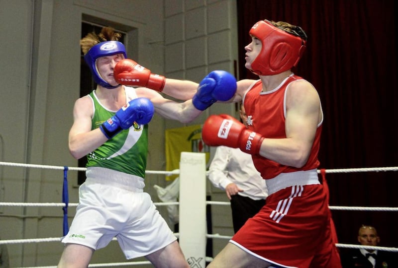 Conrad Cushanan (left) of All Saints and Ben McCourt (Townland) go toe-to-toe during their 80kg Antrim 6s final at Corpus Christi last week. McCourt went on to win what was widely considered the fight of the night, and the last one on the card. Picture by Mark Marlow 