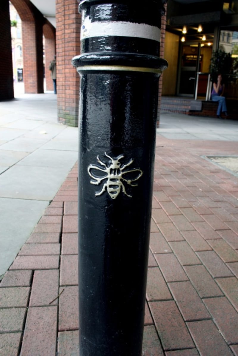 a bee motif on a bollard (Natalia Balcerska Photography/Flickr)