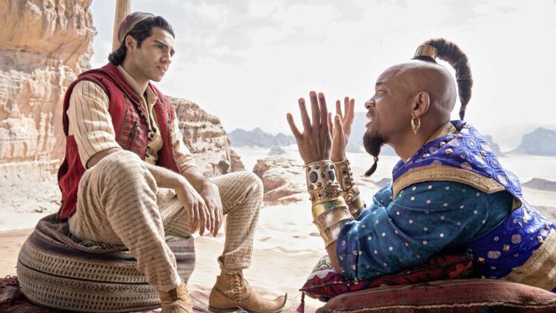 Will Smith as Genie and Mena Massoud in the title role in Disney&#39;s new version of Aladdin 