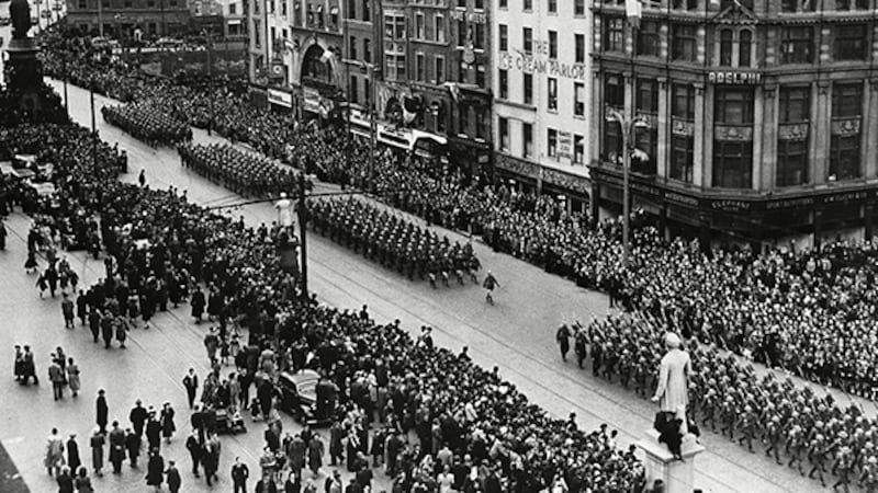 Irish troops parade on O'Connell Street as part of the celebrations following the declaration of the Republic of Ireland. Picture by AP.