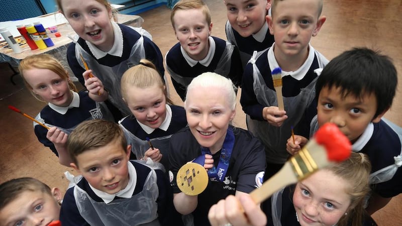 Co Down gold medallist Kelly Gallagher with members of Forthspring Inter Community group in Belfast 