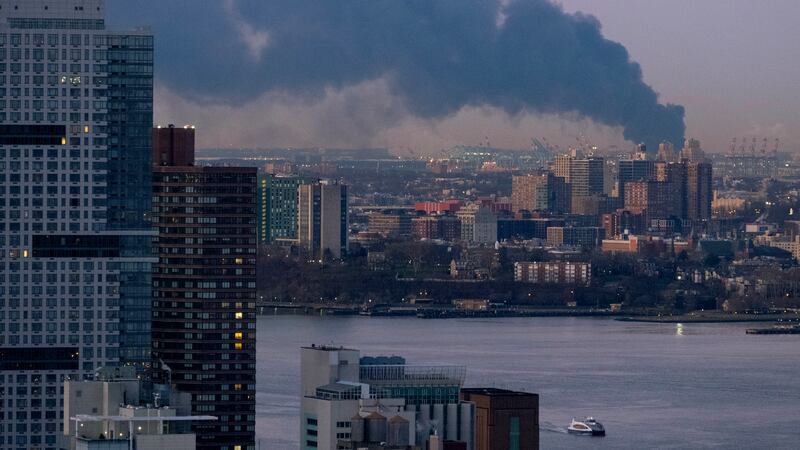 Smoke rises south of the New York borough of Manhattan as a warehouse burns in Elizabeth, New Jersey (Craig Ruttle/AP)