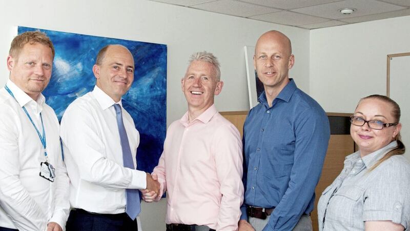 Pictured (L-R) during contract signing in 2018 are Ian Hooper, director of procurement and supply chain, and Roland Sinker, CEO, at Cambridge University Hospitals with Novosco&rsquo;s strategic advisor Patrick McAliskey, managing director John Lennon, and client director Ellen Dickson. 