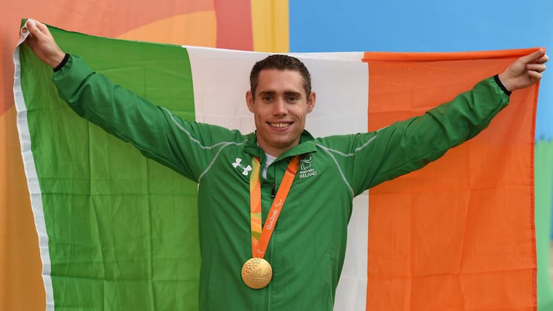 Jason Smyth with his gold medal after winning the Men&#39;s 100m T13 final at the Rio Olympic Stadium 