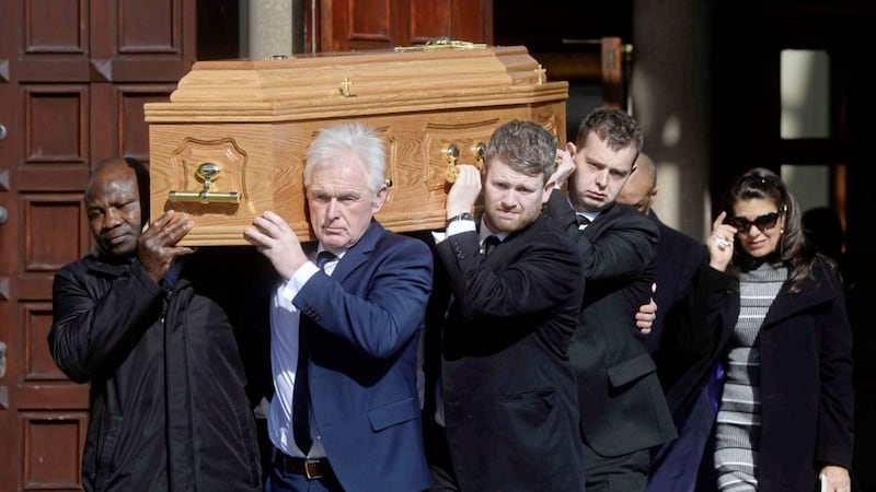 The funeral of Barney Eastwood takes place at St Colmcille&#39;s Church, Holywood. Pictured front are Danny Juma and Barney&#39;s son Peter. Picture Mark Marlow. 