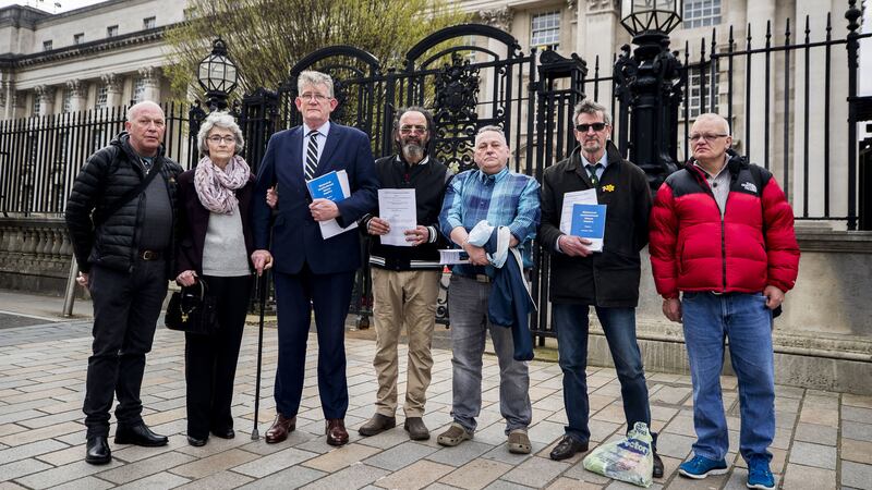 Victims and families of victims of historical instituional abuse (left to right) Gary Hoy, Kate McCausland, Jon McCourt, Kenny McLaughin, John Heaney, Eddie McCourt, Gary Hoy, and Ron Graham outside Belfast's High Court, after a failed bid to force Secretary of State Karen Bradley to compensate those abused&nbsp;