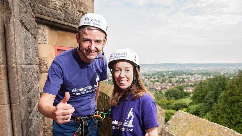 Q Radio presenter Owen Larkin preparing for the abseil with Kate Dunlop from the Meningitis Research Foundation 