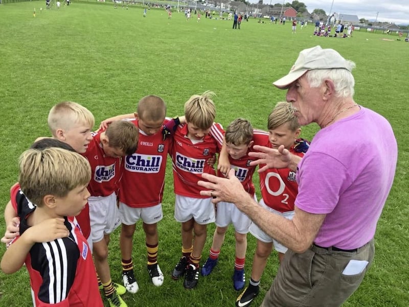 The Cork U9s listening intently to Mickey Niblock during a tournament in Youghal recently. 