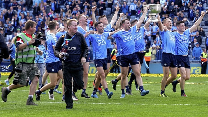 The Dublin players celebrate with the Sam Maguire Cup after a third All-Ireland title win in-a-row. Picture by Seamus Loughran 