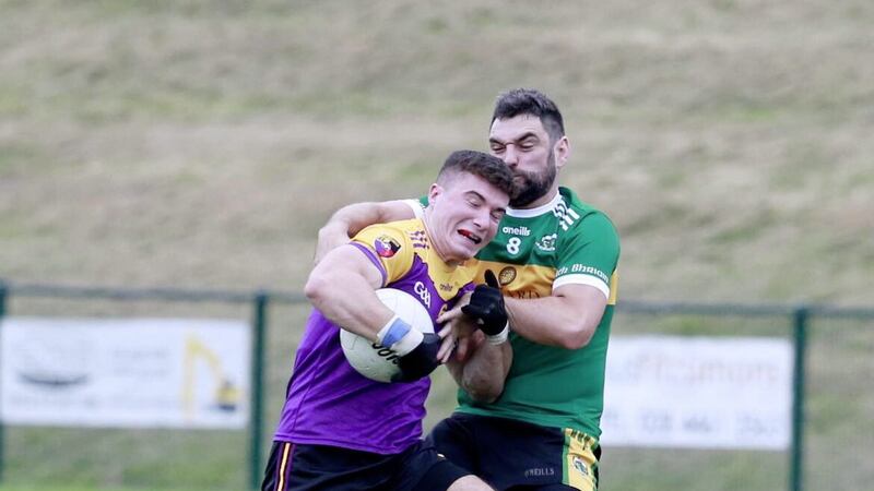 Carryduff&#39;s Daniel Guinness tussles with Bryansford&#39;s Phillip Bonny during the Down SFC first round match at RGU Downpatrick. Pic Philip Walsh 