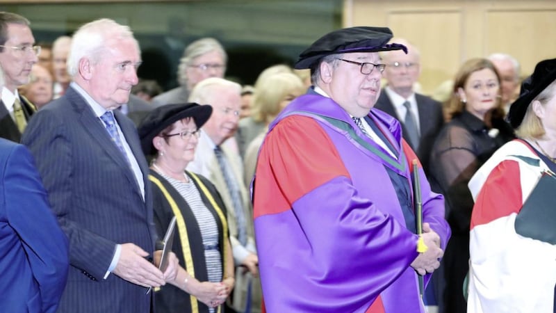 Former taoiseach Brian Cowen receives an honorary degree from the National University of Ireland at Dublin Castle Picture: Niall Carson/PA 