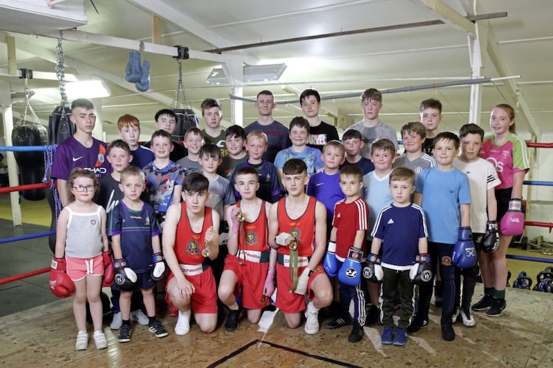 East Down Boxing Club&#39;s Irish champions Oisin Mulholland, Bryce Collins and Emmett O&#39;Donnell with other young members at the club&#39;s base outside Crossgar. Picture by Cliff Donaldson 
