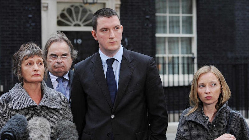 The family of murdered solicitor Pat Finucane including his widow Geraldine, son John (centre) and daughter Katherine standing with their solicitor Peter Madden&nbsp;