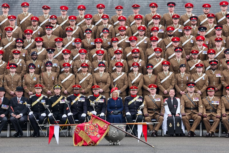 Camilla poses for a group photograph with The Royal Lancers