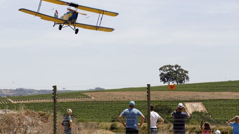 A vintage biplane approaches the landing strip at the airport near the town of Stellenbosch, South Africa Picture by Schalk van Zuydam/AP 