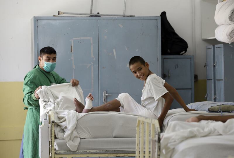 An Afghan boy receives medical care at the International Committee of the Red Cross (ICRC) physical rehabilitation center after being injured in fighting between the Taliban and Afghan security personnel, in Kabul, Afghanistan, on August 10 2021. Picture by Mariam Zuhaib, AP &nbsp;