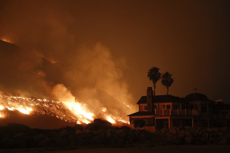 A wildfire threatens homes as it burns along the 101 Freeway (Jae C. Hong/AP)