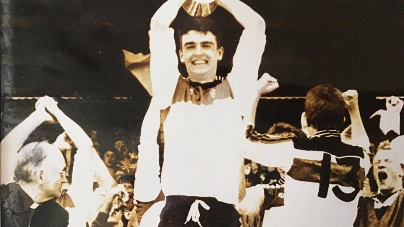  Eamon Burns lifts the Hogan Cup for St Patrick's, Maghera in 1990.