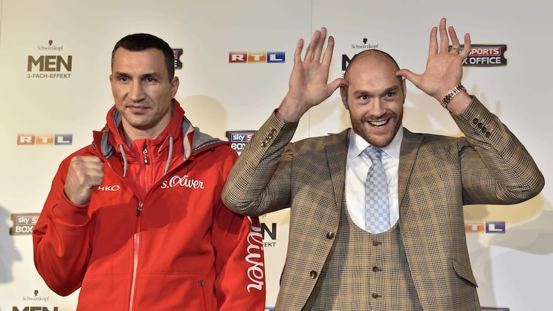 Challenger Tyson Fury doesn't let things get too serious at his press conference with world boxing champion Wladimir Klitschko in Duesseldorf on Tuesday<br />Picture by AP