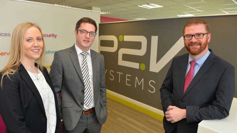Economy minister Simon Hamilton, right, welcomes P2V&#39;s growth plans with its managing director Stephen McCann and marketing director Jackie Wilson 