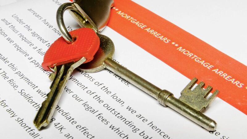 House keys on a bank letter informing customer of Mortgage Arrears and repossession  with bank statement 