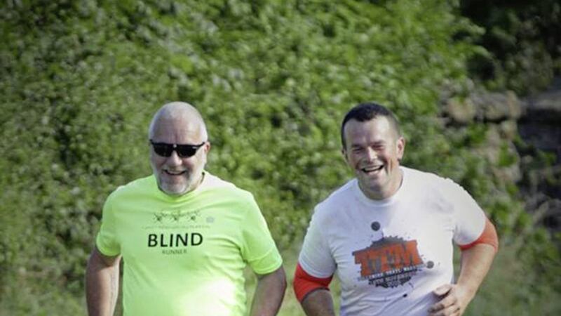 Carrickfergus man Tony Barclay and guide runner Tim Redmond compete in a half marathon 
