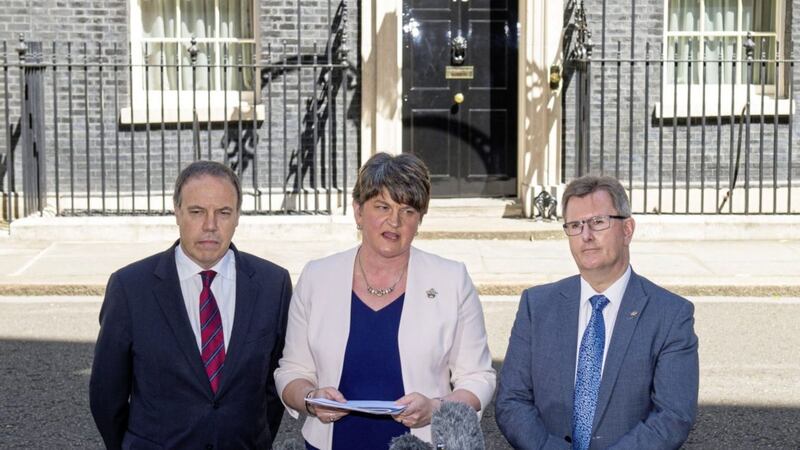 DUP leader Arlene Foster, DUP deputy leader Nigel Dodds (left) and MP Sir Jeffrey Donaldson outside 10 Downing Street in London after the party agreed a deal to support the minority Conservative government. PRESS ASSOCIATION Photo. Picture date: Monday June 26, 2017. Photo credit should read: Dominic Lipinski/PA Wire. 