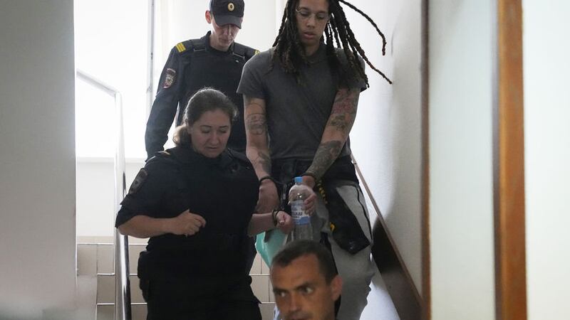 WNBA star and two-time Olympic gold medalist Brittney Griner is escorted to a courtroom for a hearing, in Khimki just outside Moscow, Russia, Monday, June 27, 2022 (AP Photo/Alexander Zemlianichenko)&nbsp;