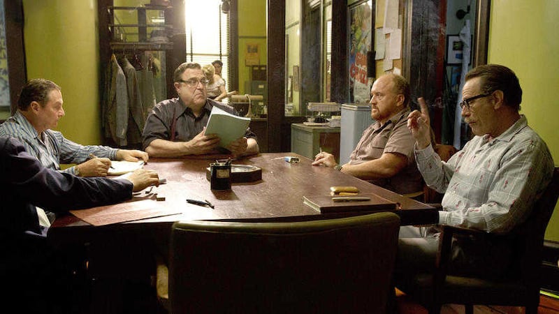 John Goodman, Louis CK and Bryan Cranston with other cast members in a scene from Trumbo 
