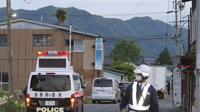 Two police officers and a woman died in the attack (Kyodo News/AP)