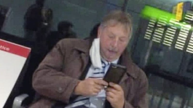 Sammy Wilson was spotted at Heathrow Airport with a covering dangling from one ear 