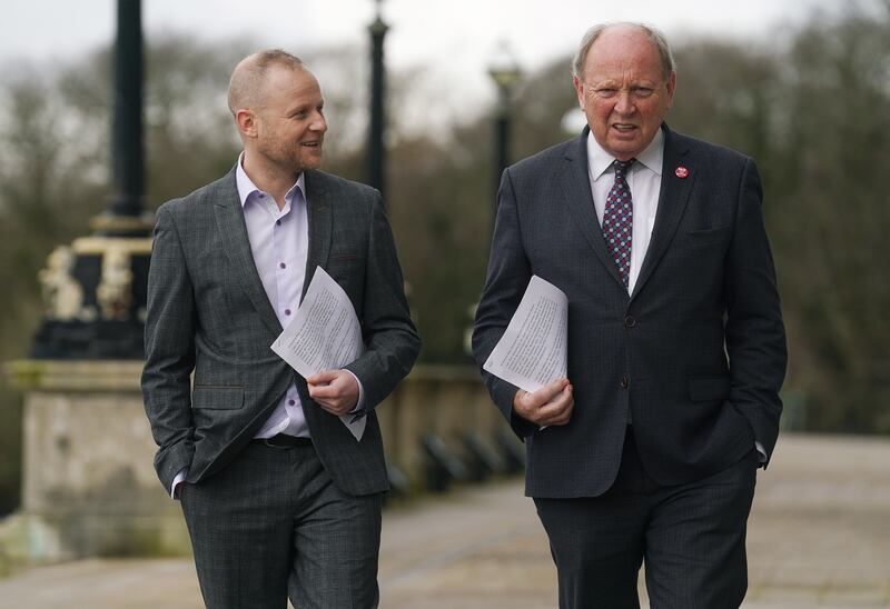 Loyalist activist Jamie Bryson and TUV leader Jim Allister on the steps of Stormont