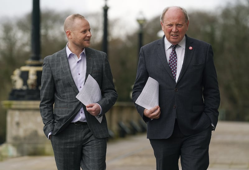 Loyalist activist Jamie Bryson and TUV leader Jim Allister on the steps of Stormont