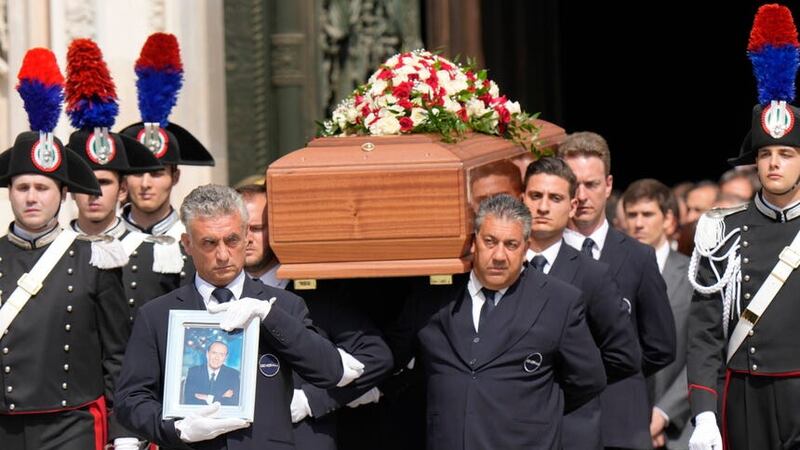 The coffin of media mogul and former Italian premier Silvio Berlusconi leaves the Milan’s Gothic Cathedral at the end his state funeral (Luca Bruno/AP)