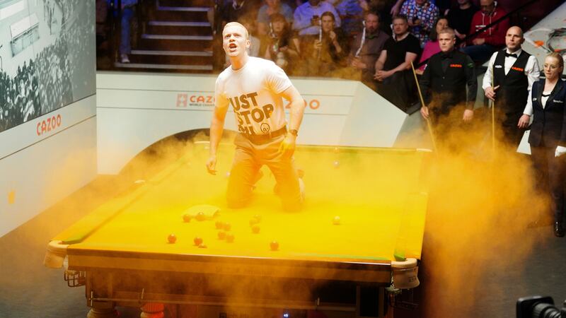 A protestor wearing a Just Stop Oil t-shirt disruped play at the World Snooker Championship in Sheffield's Crucible Theatre on Monday evening. Picture by Mike Egerton/PA Wire