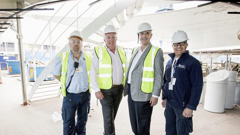Pictured on the Azamara Pursuit are Damien Morgan, contract director for MJM; Larry Pimentel, president and chief executive of Azamara Club Cruises; Brian McConville of MJM Group and ship captain Antonio Toledo 