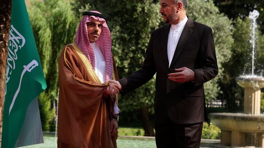 Iranian foreign minister Hossein Amirabdollahian, right, and his Saudi counterpart Prince Faisal bin Farhan shake hands (Vahid Salemi/AP)