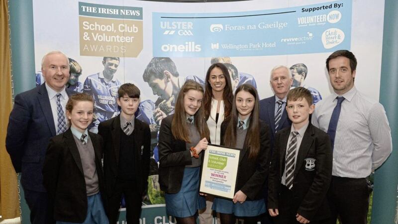 Pupils from St. Ciaran&rsquo;s College Ballygawley Aine Bogue, Jack McNelis, Caoimhe Connolly, Caoimhe McCresh and Liam McKenna along with their teacher Darren McCann, receive their award for Post Primary School of the Year at the Irish News School, Club &amp; Volunteer Awards from Paula O&rsquo;Hagan of Clonduff &amp; Down Camogie and Thomas Hawkins, Irish News Sports Editor. 