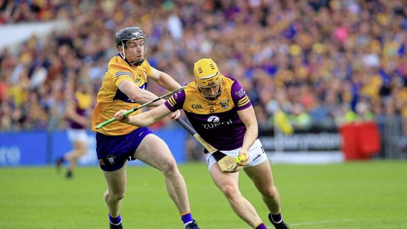 Wexford's Damien Reck up against Clare's Tony Kelly in Saturday's All-Ireland SHC quarter-final at Semple Stadium. <br />Picture Seamus Loughran