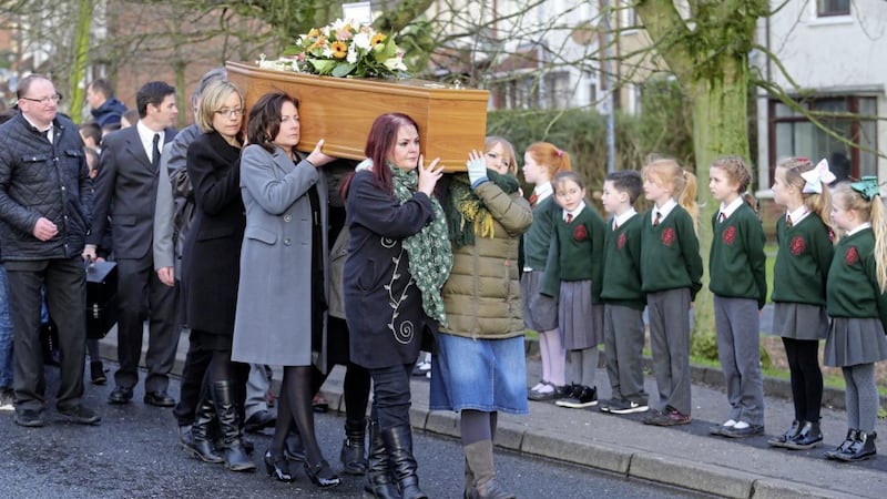 Pupils from Bunscoil Phobal Feirste form a guard of honour at the funeral of Se&aacute;n Mac Aindreasa who helped set up the school in 1971. Picture by Mal McCann 