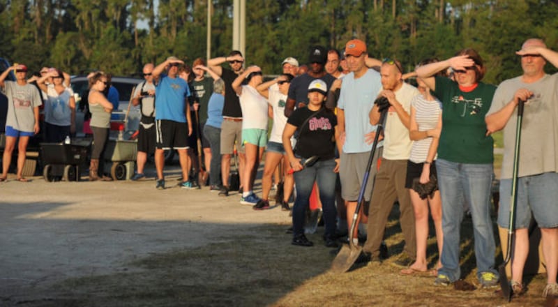 Florida residents await the arrival of sandbags