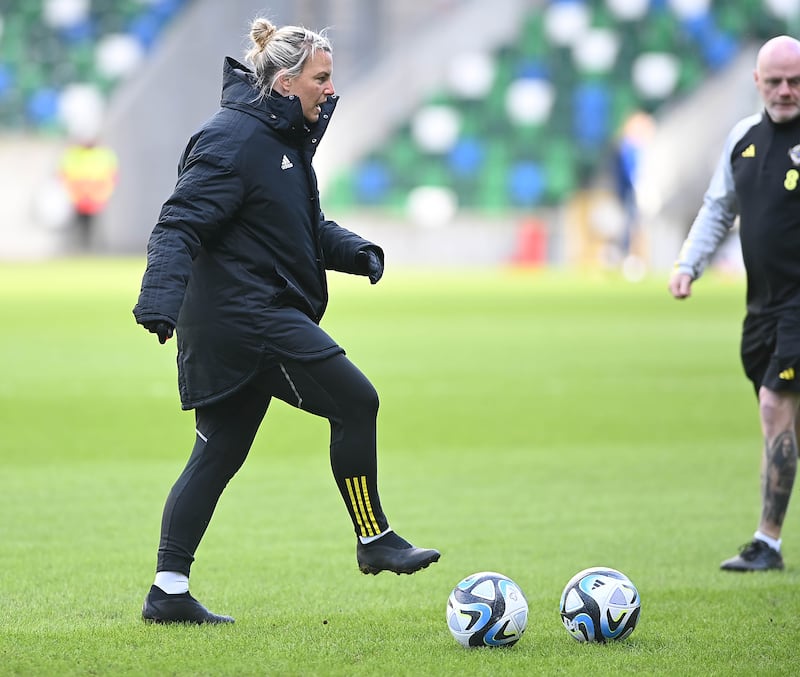Tanya Oxtoby, manager of the Northern Ireland senior women's team, traps a ball in training.