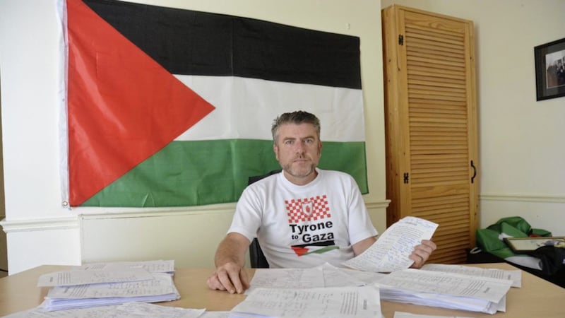 Palestinian campaigner John Hurson pictured with a petition signed by several high profile GAA members                                     