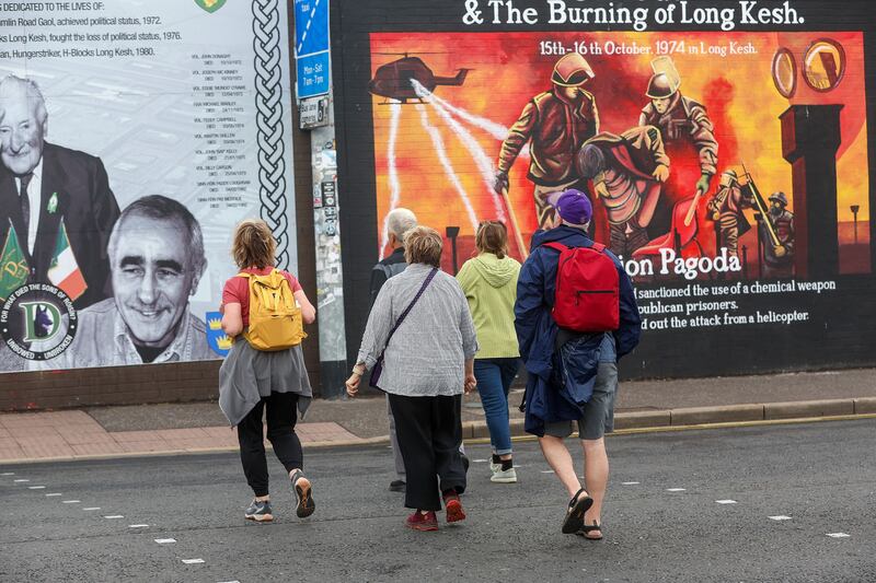 Tourists visit the international mural wall on the Falls Road, west Belfast. PIcture Mal McCann