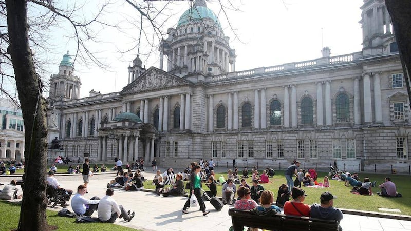 People enjoying the lawns outside Belfast City Hall. Picture by Mal McCann 