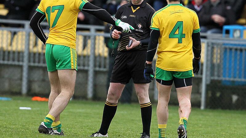 Donegal&rsquo;s Neil McGee is yellow carded by referee Dan Mullan during Sunday&rsquo;s McKenna Cup clash with St Mary&rsquo;s in Letterkenny&nbsp;