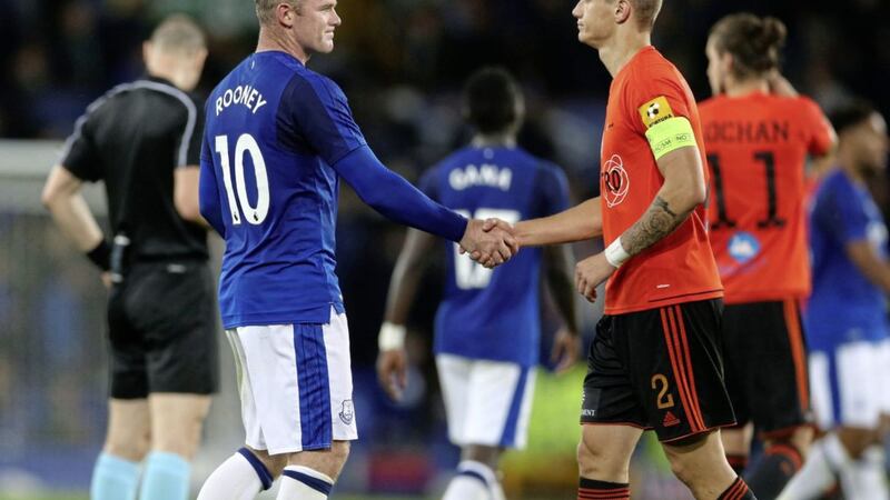 Everton&#39;s Wayne Rooney shakes hansd with Ruzomberok&#39;s Dominik Kruzliak after the final whistle at Goodison 