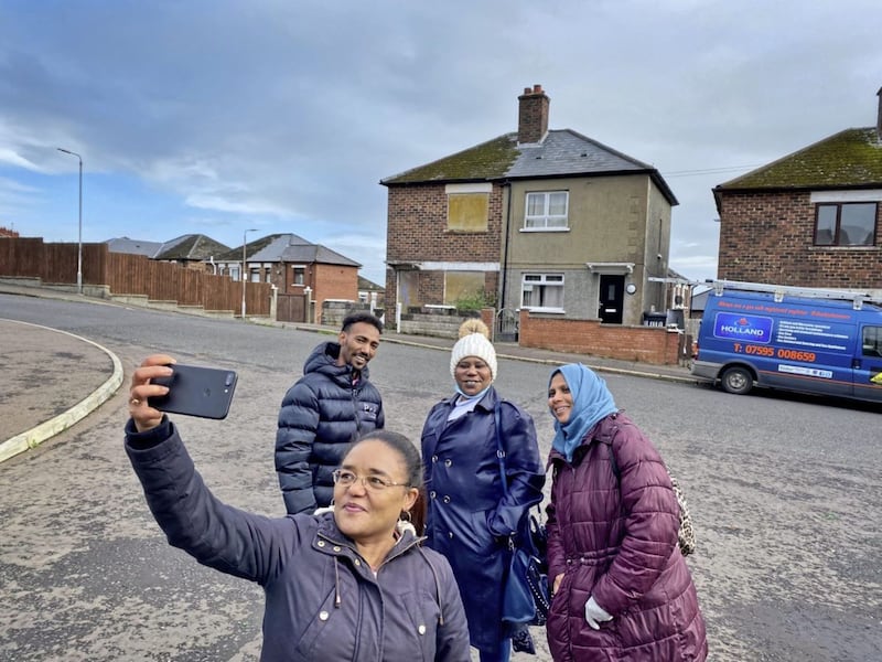 Twasul Nasraldeen (PPR) with some of families creating a photographic map of the city where potential homes could be built. Picture by Mal McCann 