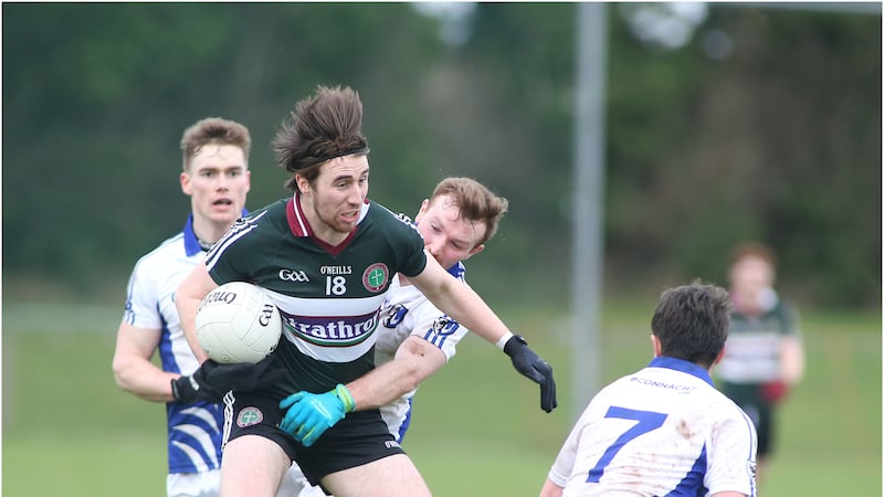 St Mary's Brian &Oacute;g McGilligan gets away with the ball during Tuesday's game in Glenavy <br />Picture by Hugh Russell&nbsp;